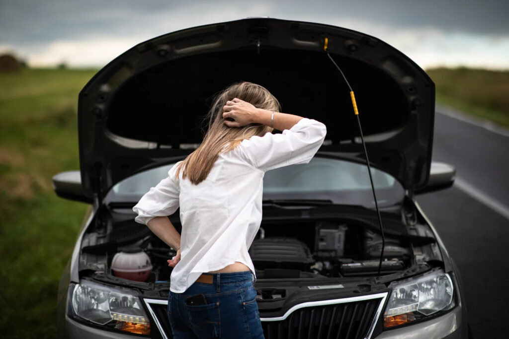 Woman with broken down car